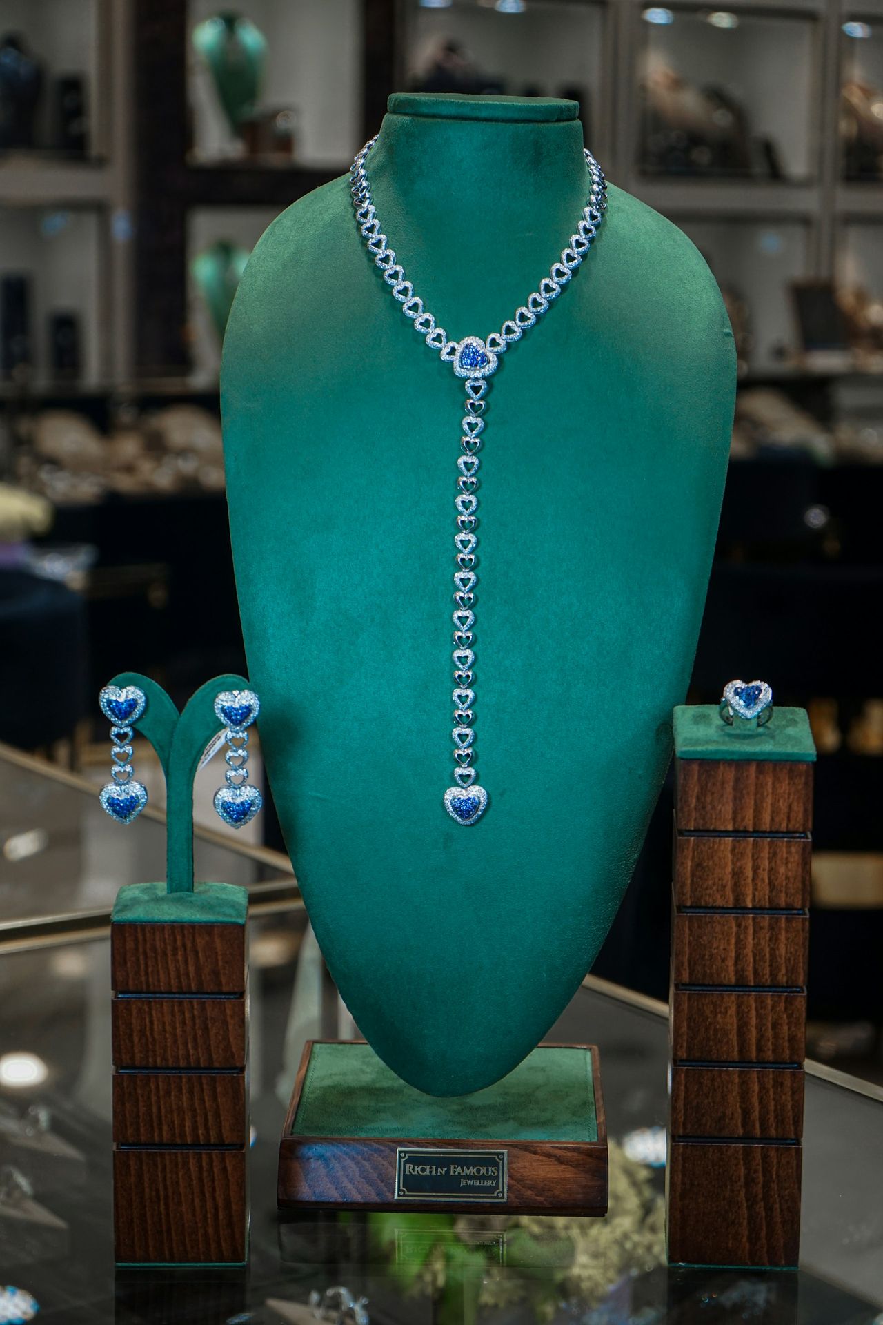a green vase with blue and white designs